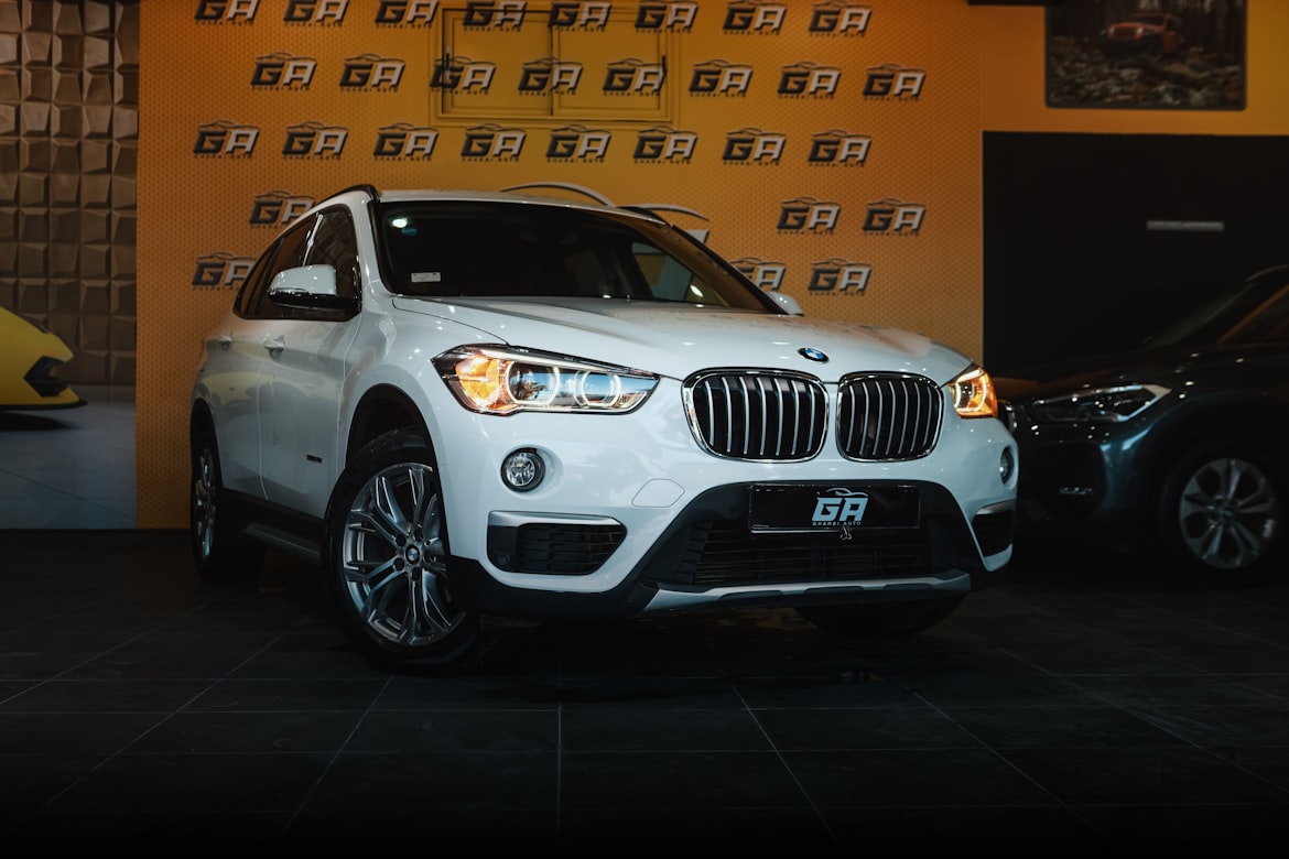 The all new BMW X1 compact luxury SUV parked, showing its bold kidney grille and LED headlights.
